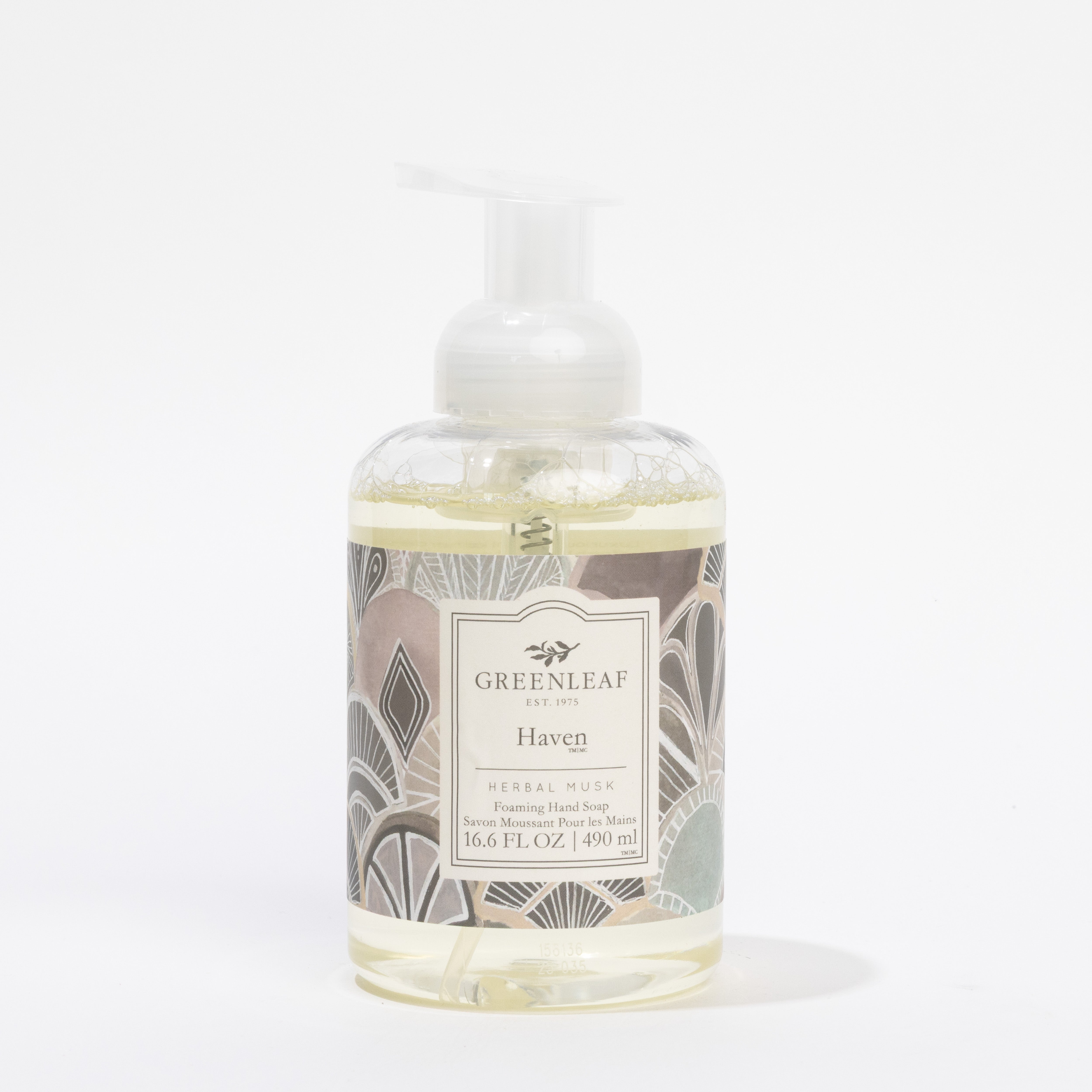 A clear pump bottle of Greenleaf Gifts Haven Foaming Hand Soap, featuring a patterned label and enriched with coconut oil, 16.6 fl oz (490 ml), is shown against a plain white background.