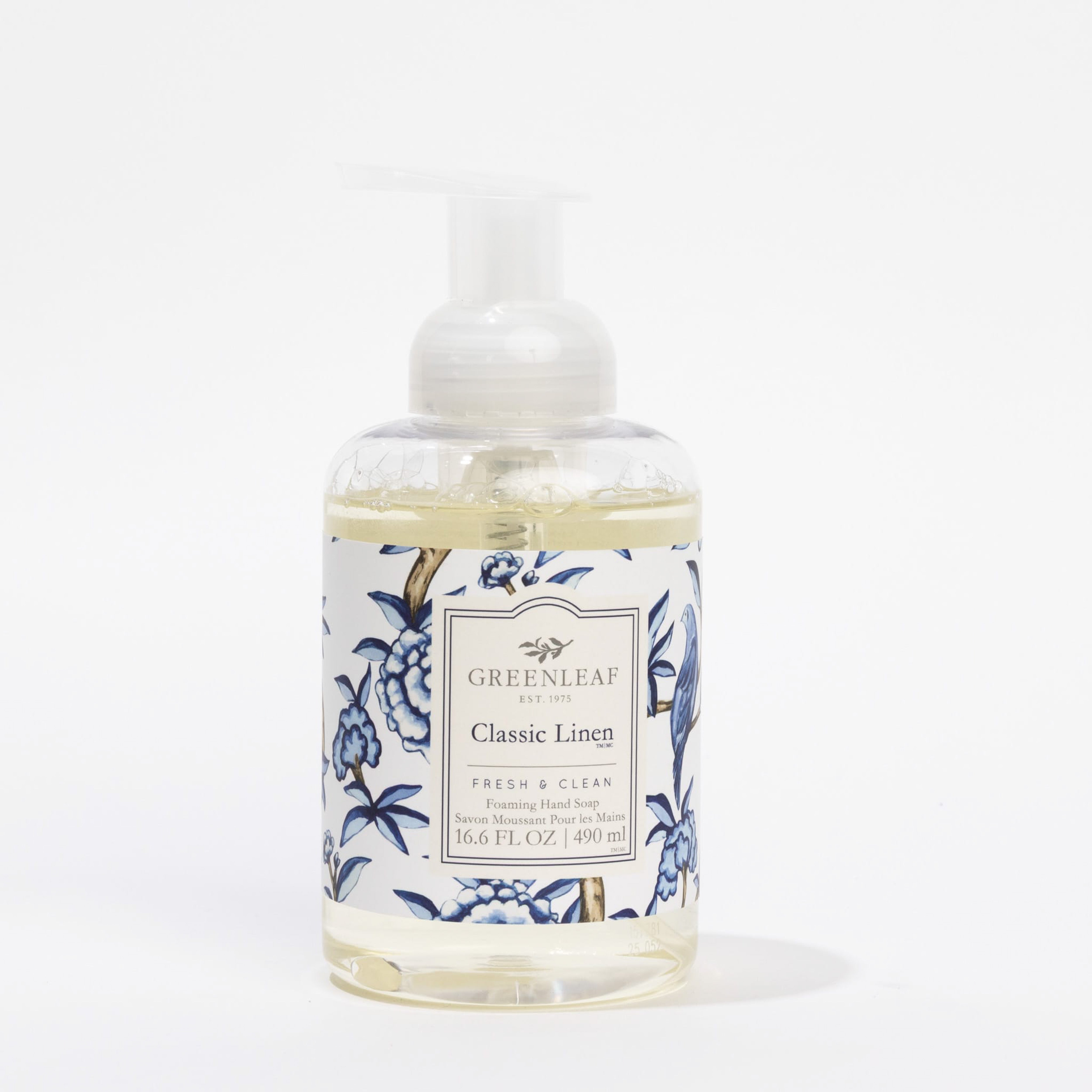A clear pump bottle of Greenleaf Gifts Classic Linen Foaming Hand Soap, featuring a blue floral label and enriched with coconut oil, contains 16.6 fl oz (490 ml) and is displayed against a white background.