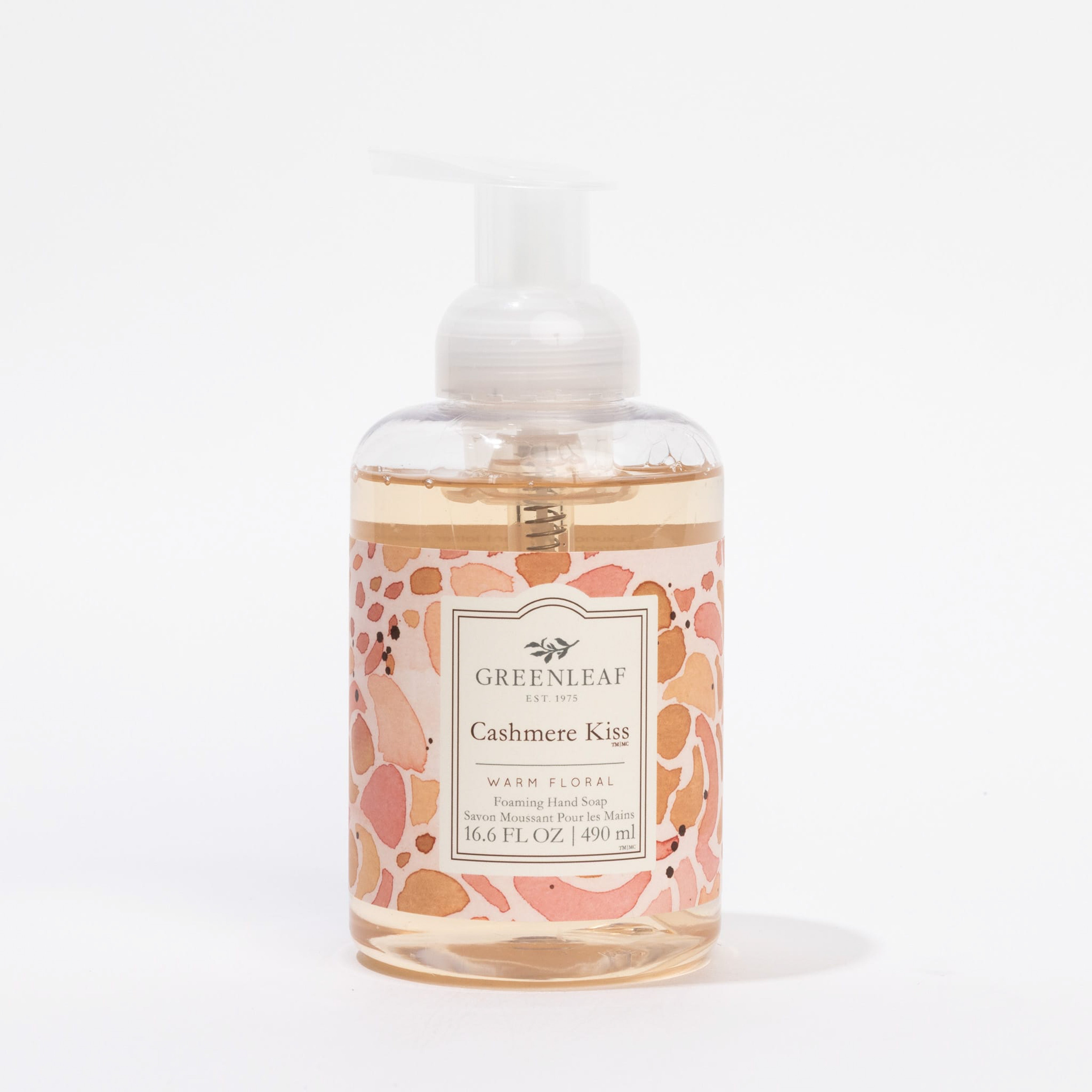 A clear pump bottle of Greenleaf Gifts Cashmere Kiss Foaming Hand Soap, enriched with coconut oil, 16.6 fl oz (490 ml), has a pink and orange abstract label and is shown against a white background.