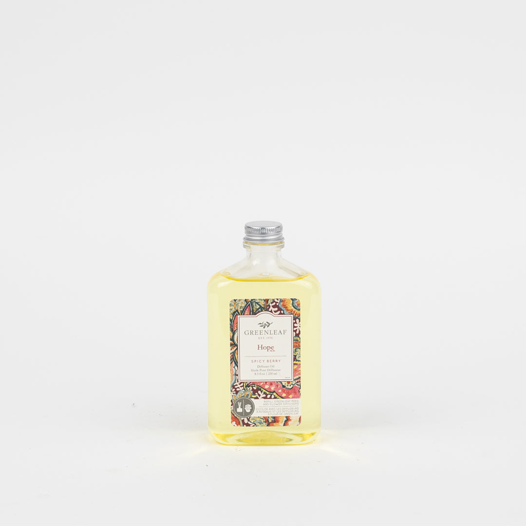 A clear bottle with yellow liquid and a silver cap, labeled Greenleaf Gifts Hope Diffuser Oil Refill, is shown against a plain white background—ideal for use as a Greenleaf Reed Diffuser or reed diffuser replacement oil.