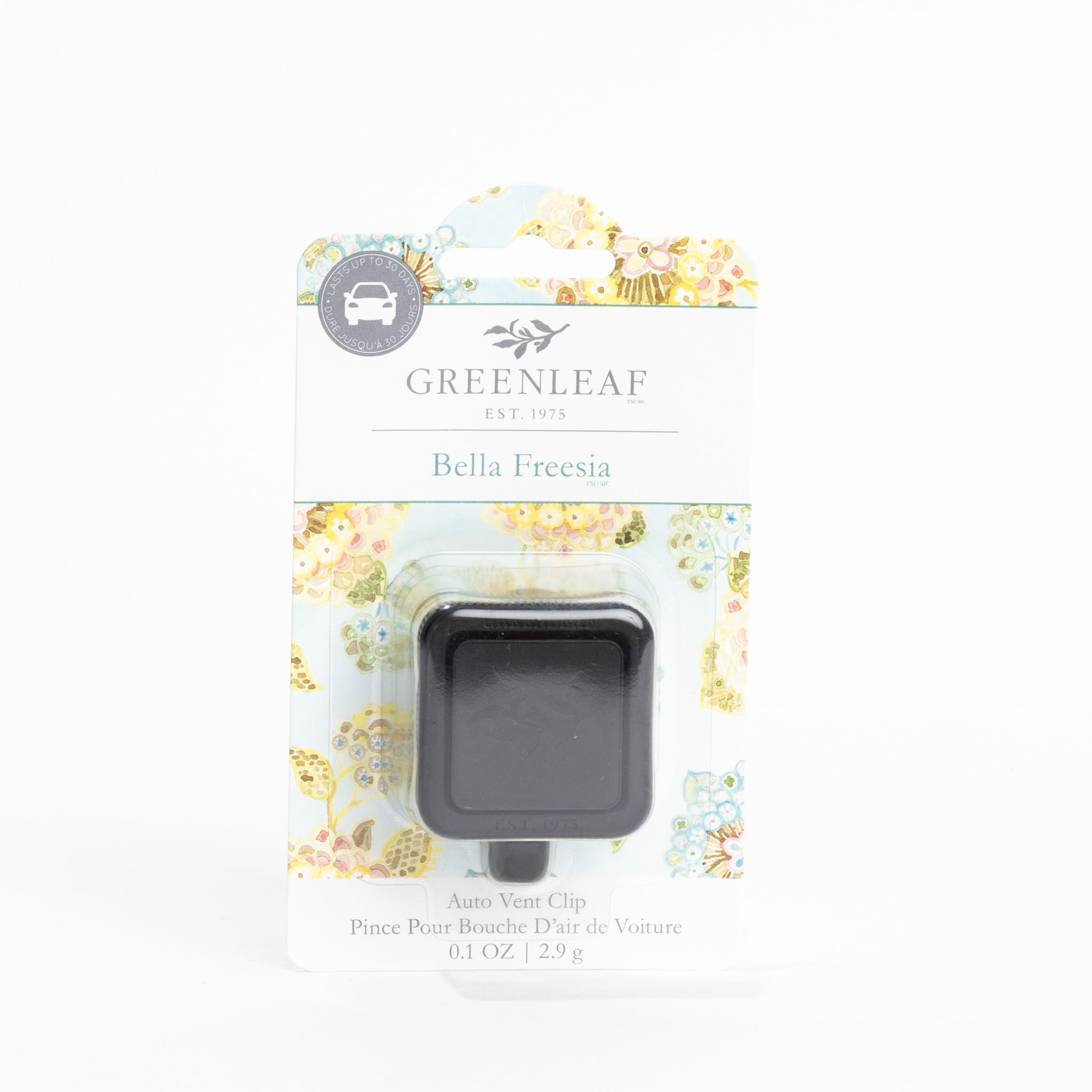A packaged Greenleaf Gifts Bella Freesia Auto Vent Clip car air freshener with floral accents and product details in English and French on the front.