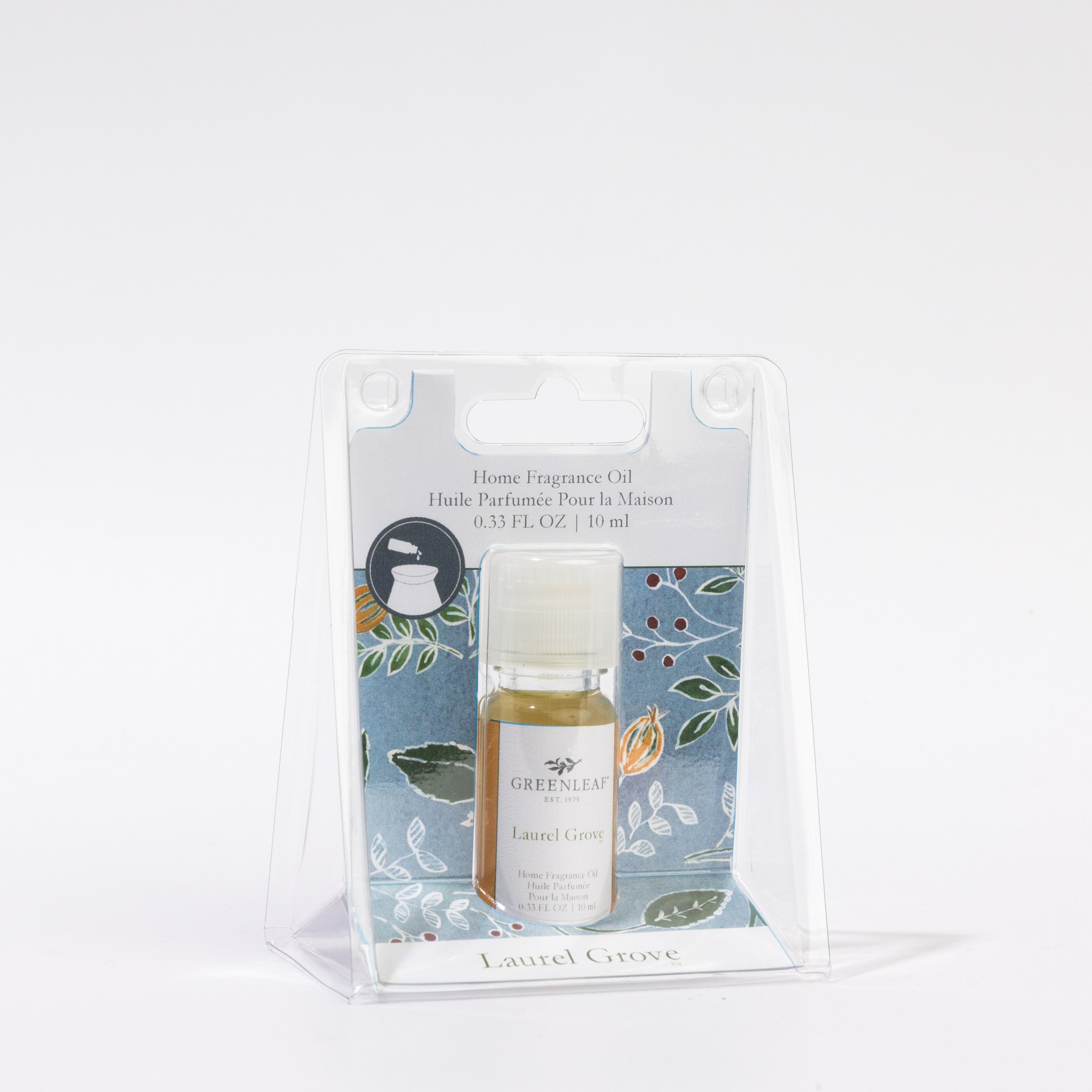 A 0.33 fl. oz. bottle of Greenleaf Gifts Laurel Grove Home Fragrance Oil, in a clear plastic case with a floral background, delivers up to 80 hours of scent.
