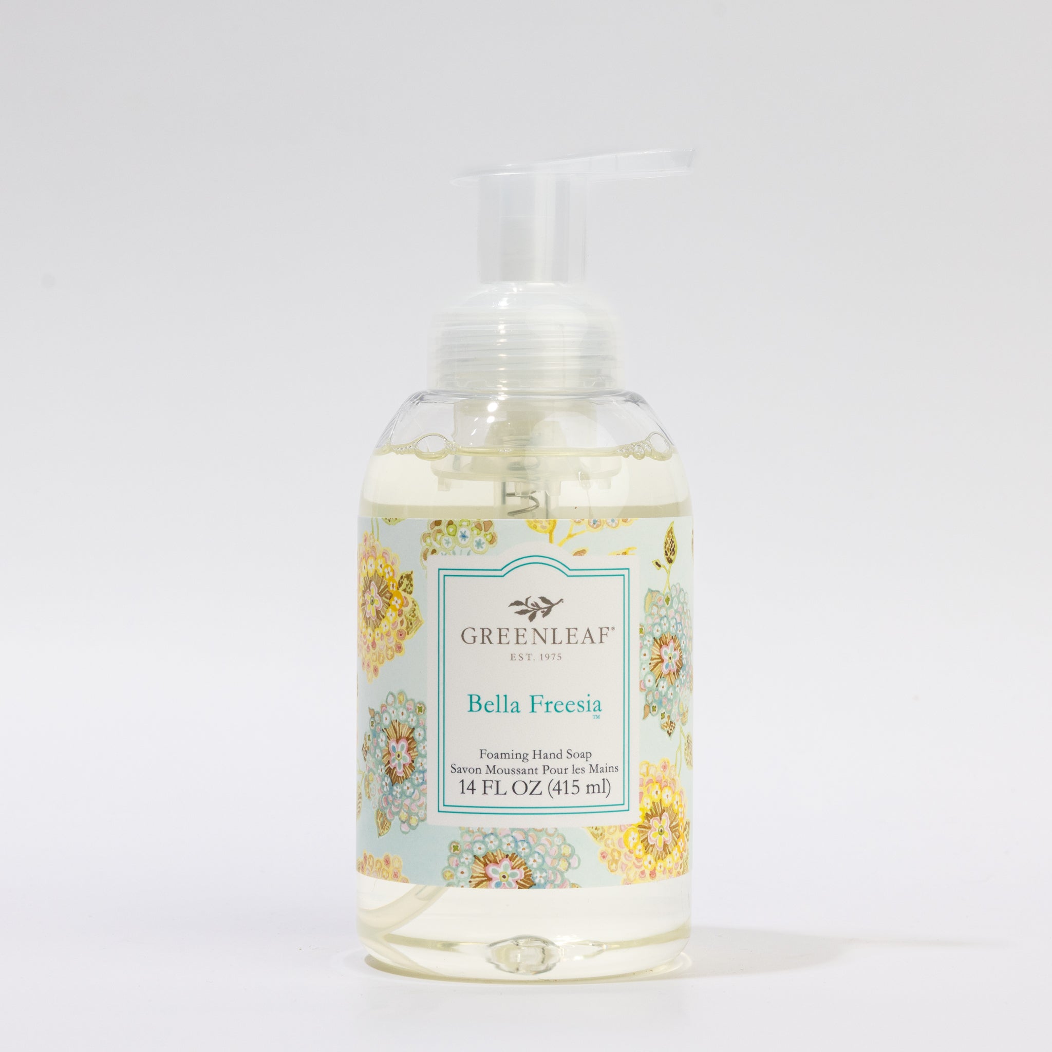 A 14 oz clear plastic pump bottle of Greenleaf Gifts Bella Freesia Foaming Hand Soap features a floral label design on a plain white background.