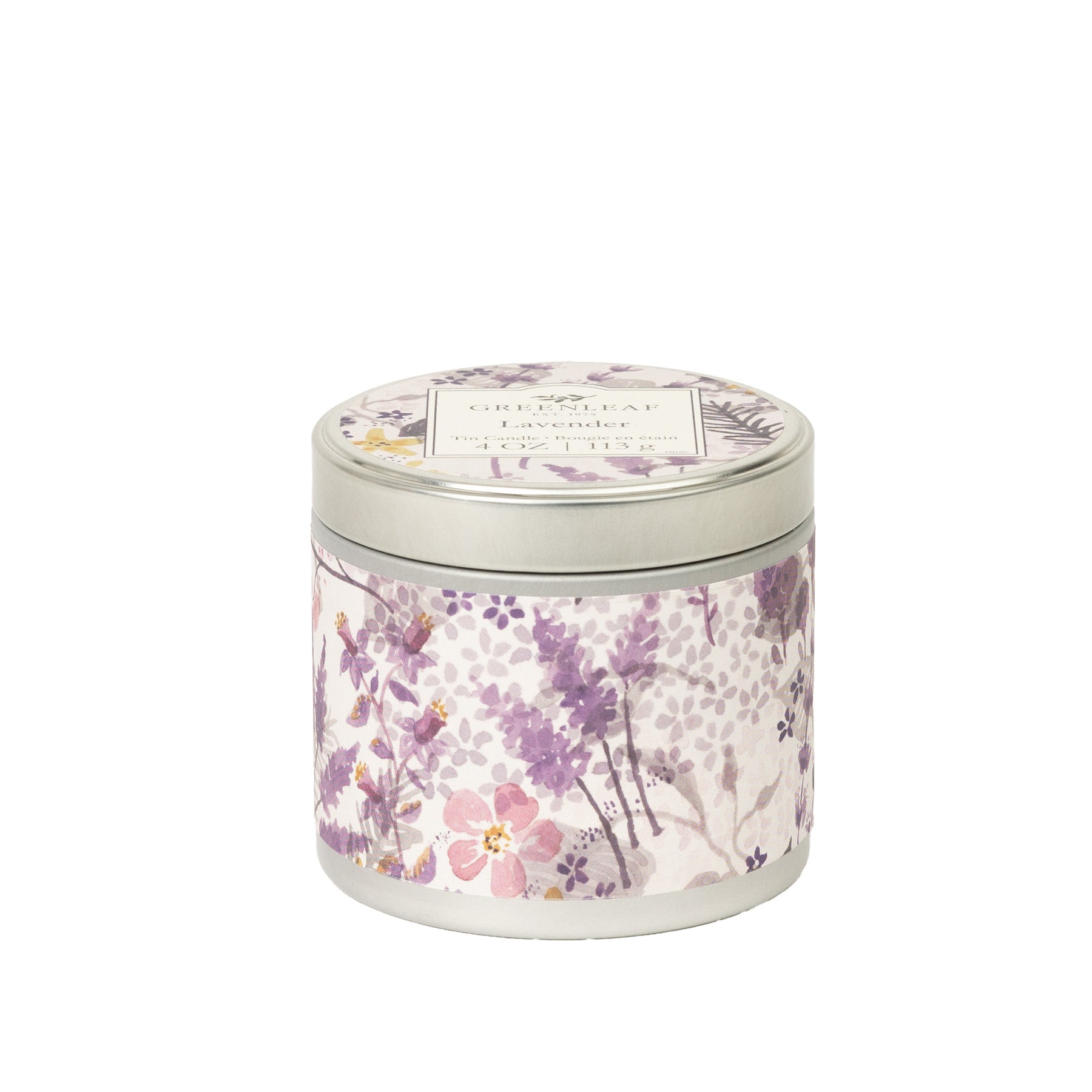 A round Lavender Tin Candle by Greenleaf Gifts comes in a silver-lidded tin with purple, pink, and green floral designs. The label on top hints at the soothing lavender fragrance inside.