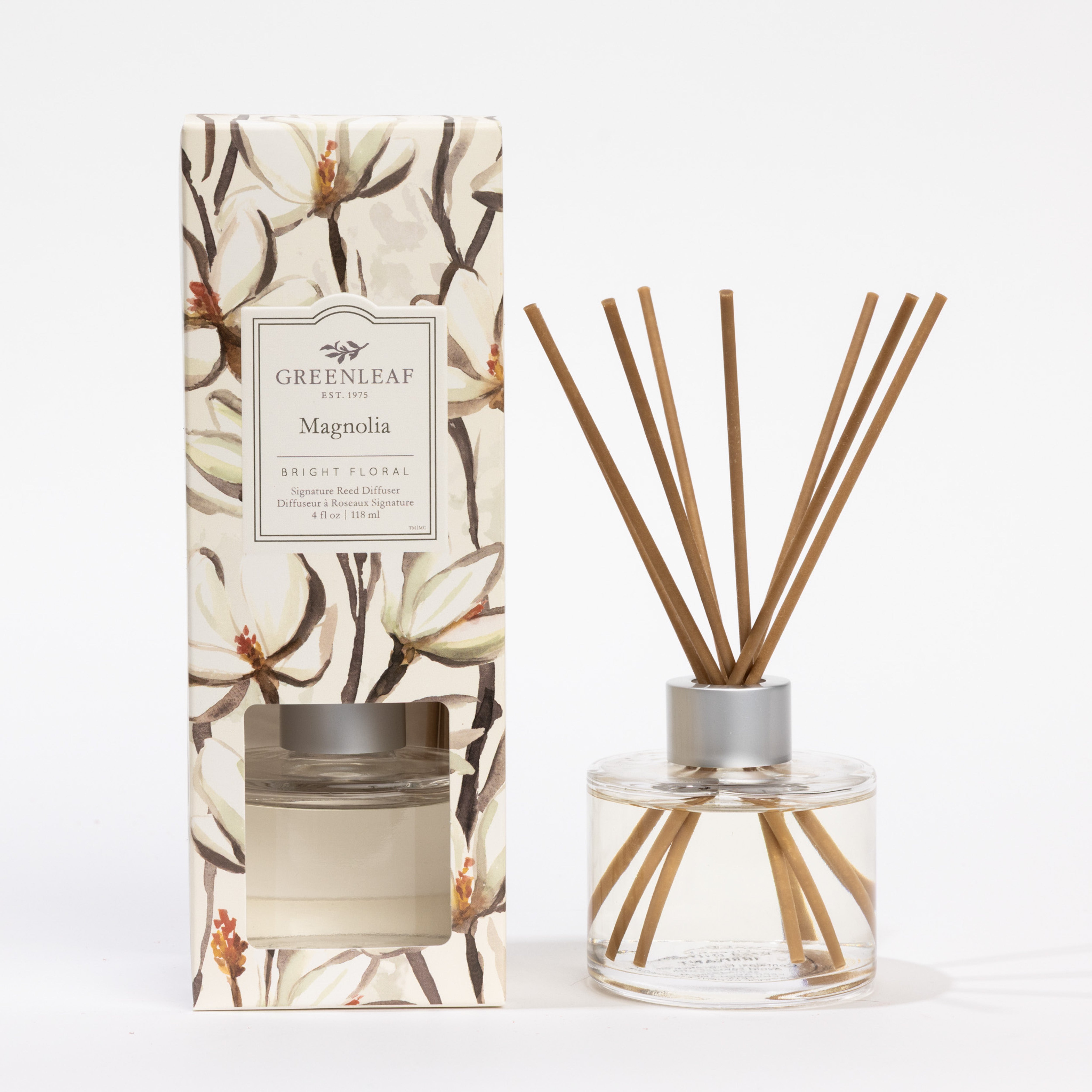 The Greenleaf Gifts Magnolia Reed Diffuser features a decorative box, clear glass bottle, and fiber reeds that diffuse a long-lasting magnolia scent.