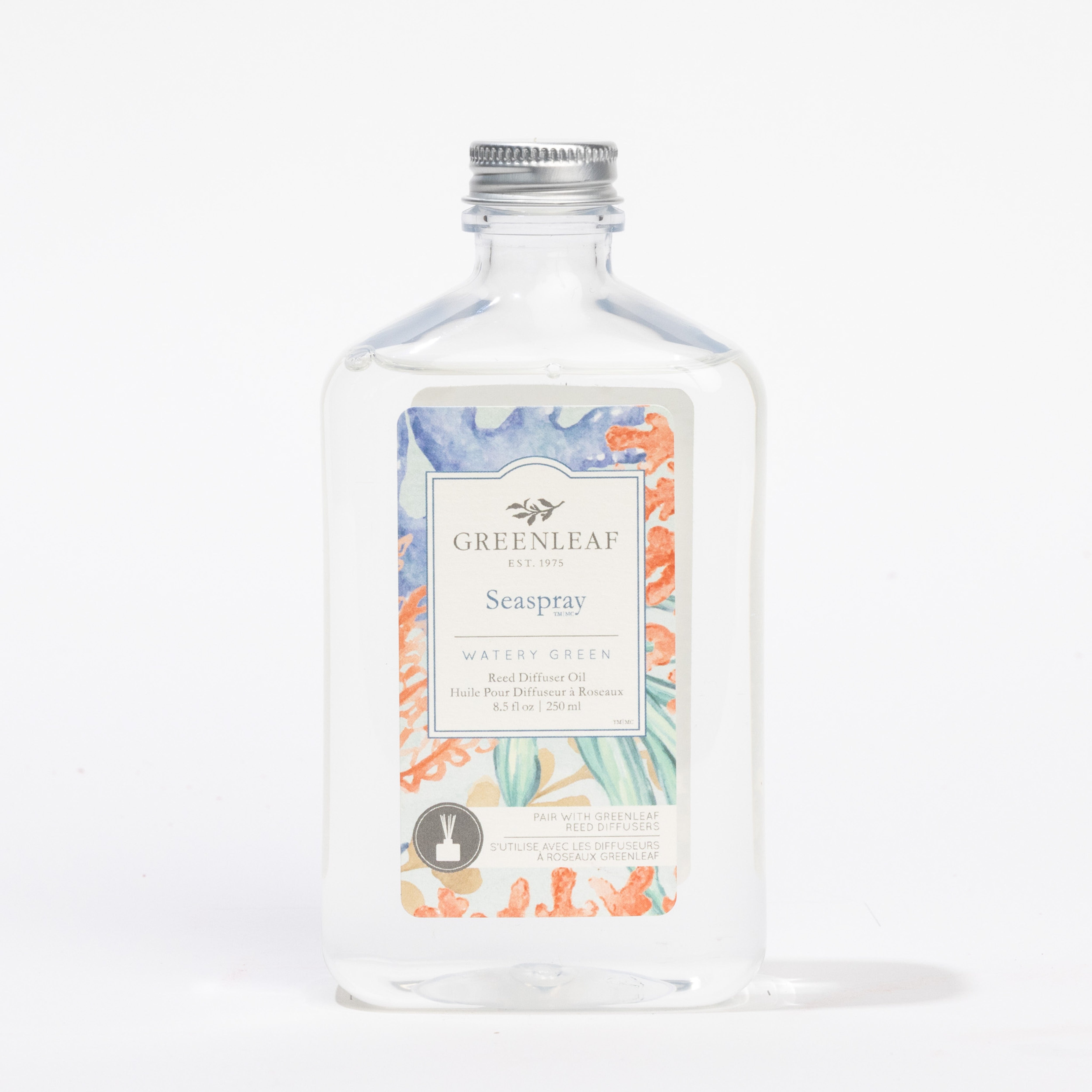 A clear bottle of Greenleaf Gifts Seaspray Diffuser Oil Refill with a silver cap and ocean-themed label—perfect as a reed diffuser replacement oil for your home.