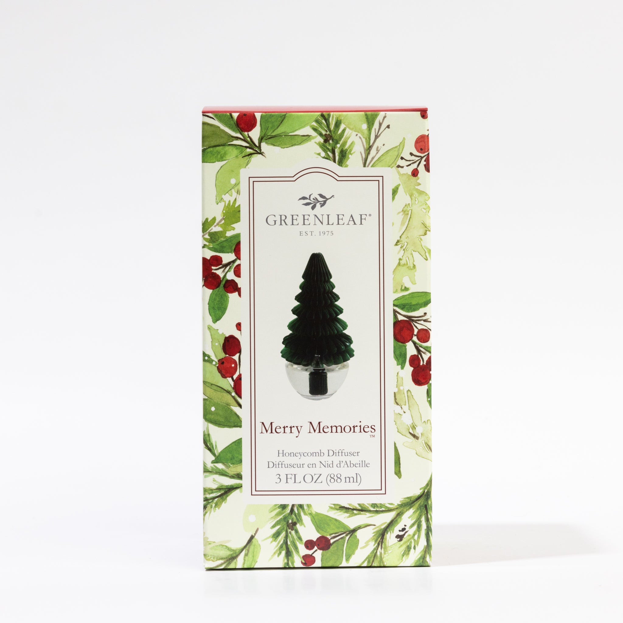 The Greenleaf Gifts Merry Memories Tree Honeycomb Diffuser comes in a holly and berry holiday box, features a Christmas tree-shaped diffuser, and contains 3 fl oz (88 ml) of festive fragrance.
