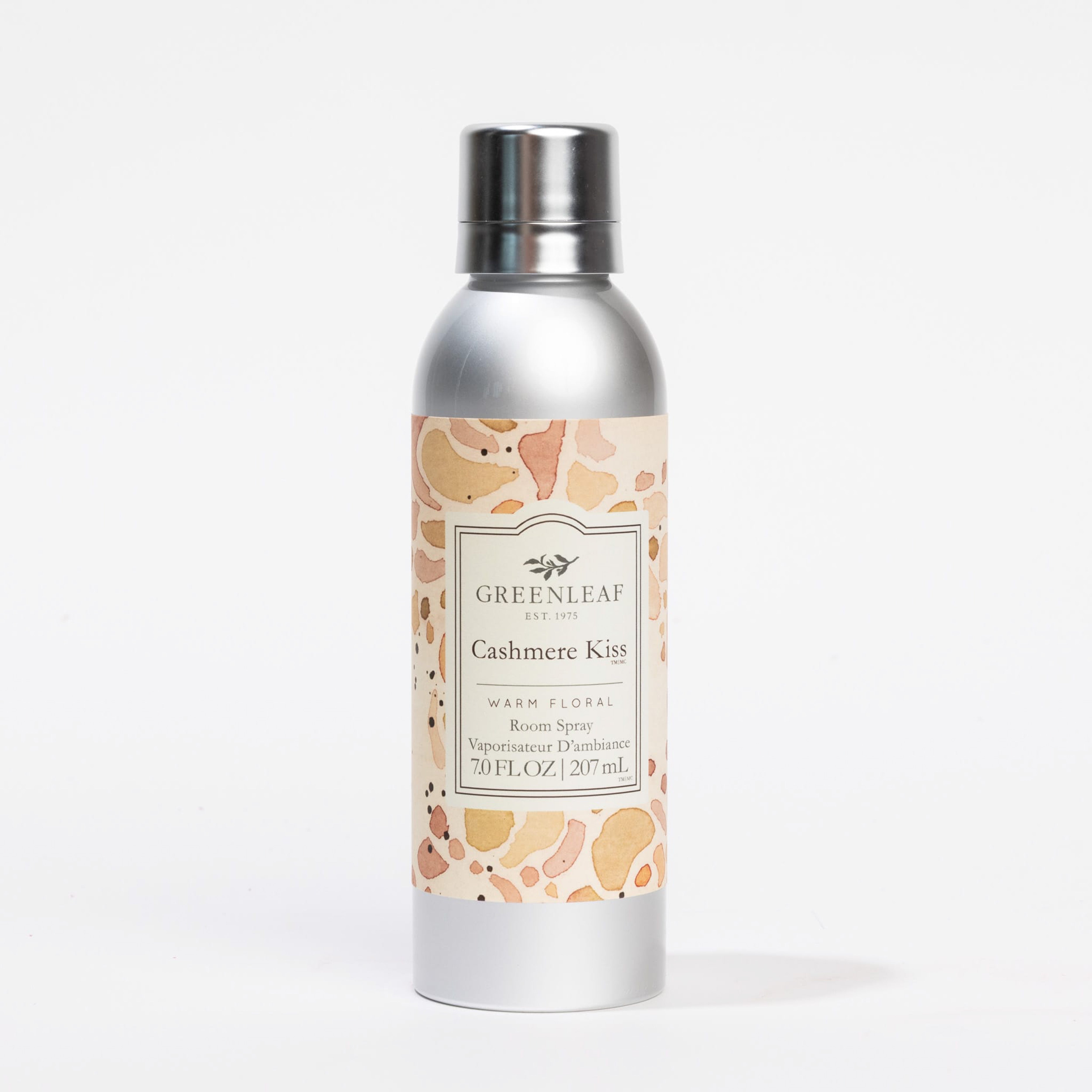 A silver spray can labeled Greenleaf Gifts Cashmere Kiss Room Spray, 7.0 fl oz / 207 mL, delivers a delightful warm floral fragrance on a white background.