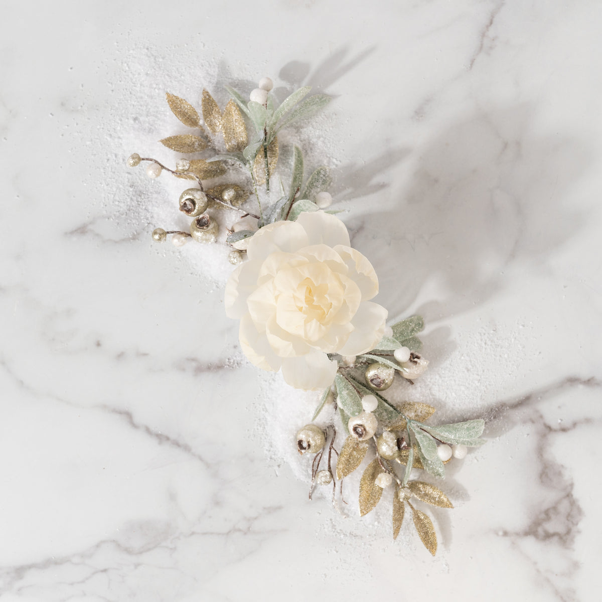 The Shimmering Snowberry Flower Diffuser by Greenleaf Gifts features frosted leaves, silver berries, and golden leaves on white marble—perfect for pairing with your favorite Greenleaf fragrance oil.