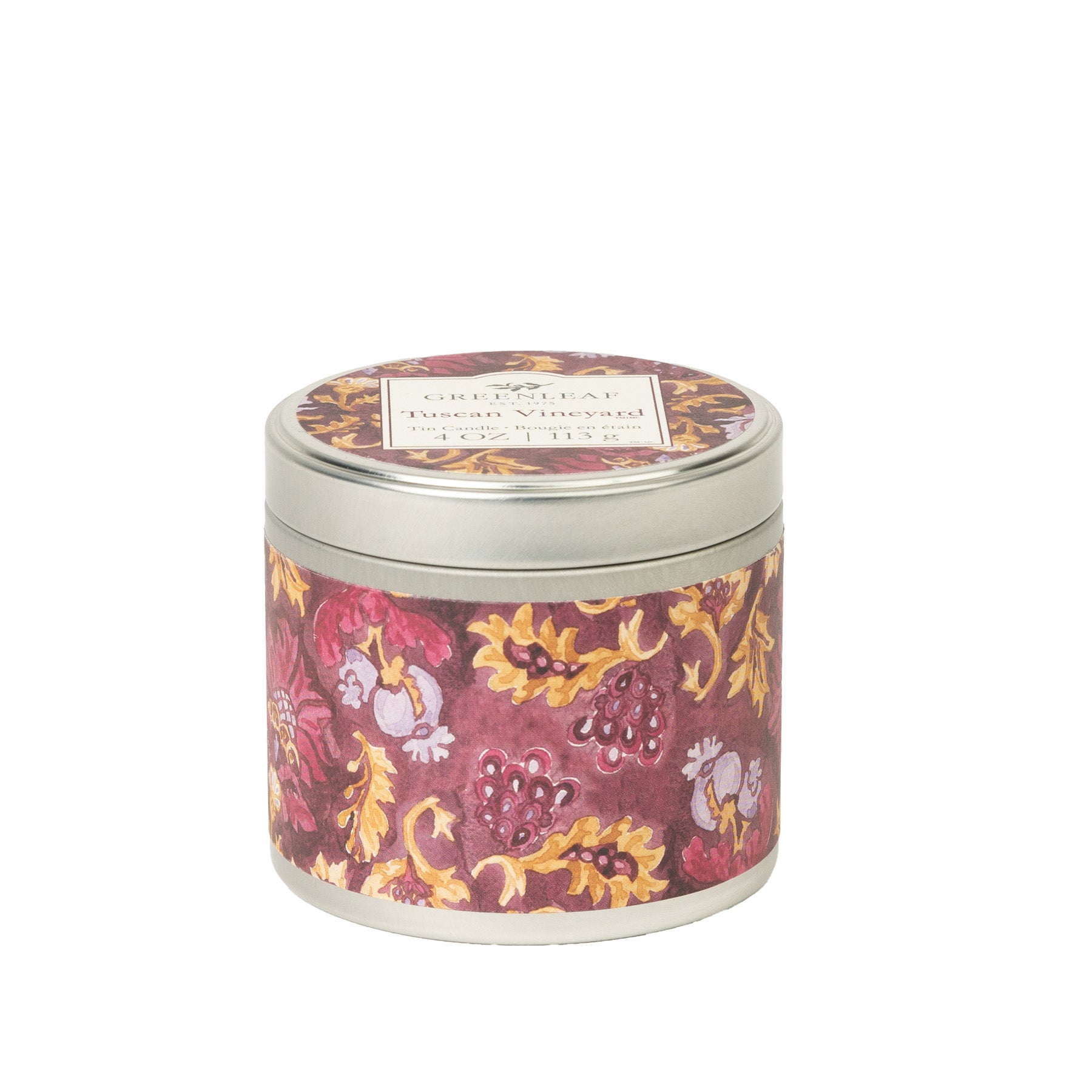 The Greenleaf Gifts Tuscan Vineyard Tin Candle features a silver lid and a vibrant red, yellow, and purple floral-grapevine design—an elegant, portable candle perfect for any setting.