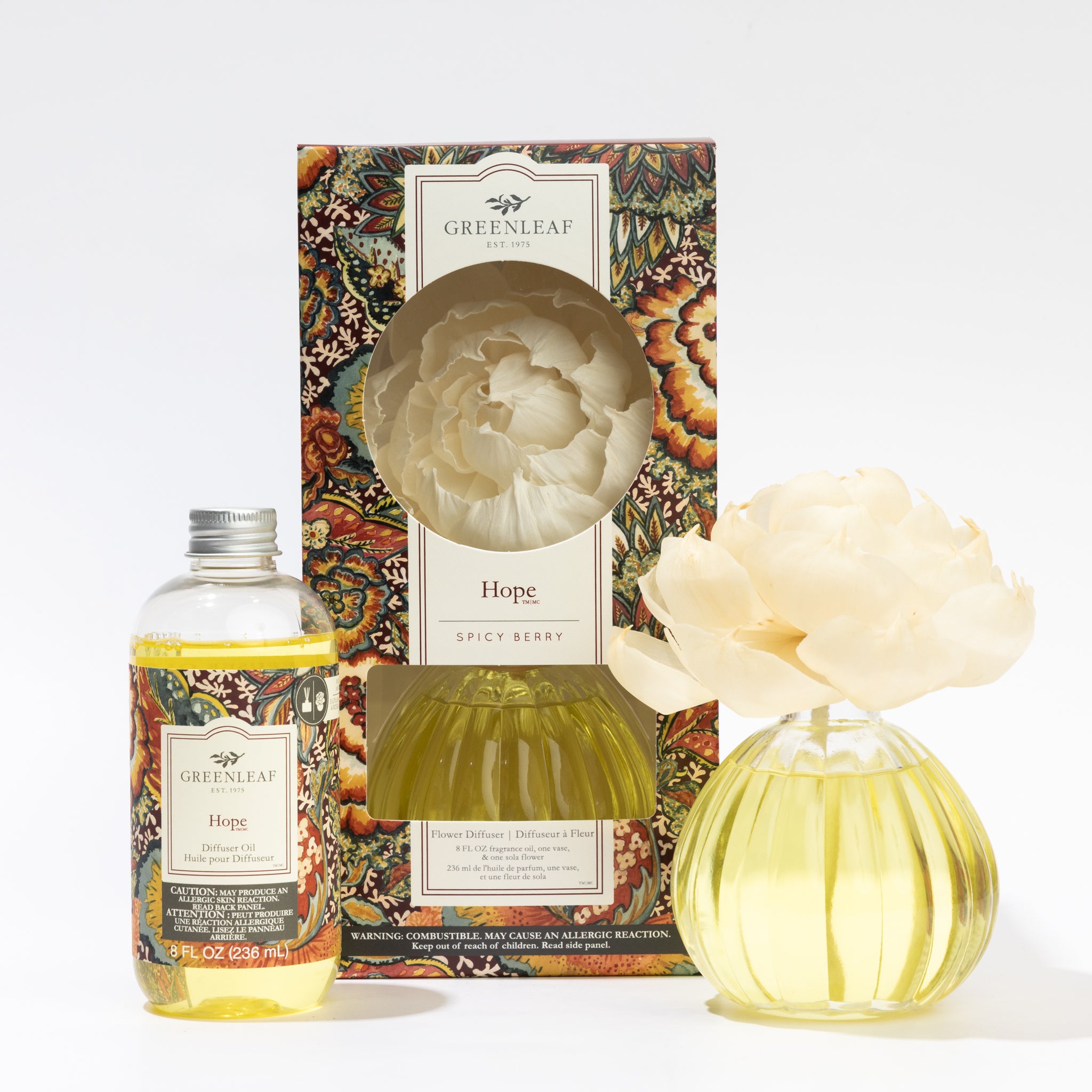 The Fast Bundle Hope Flower Diffuser & Fragrance Refill Oil set includes a decorated box, a yellow fragrance oil bottle, and a round glass diffuser with a cream artificial flower.