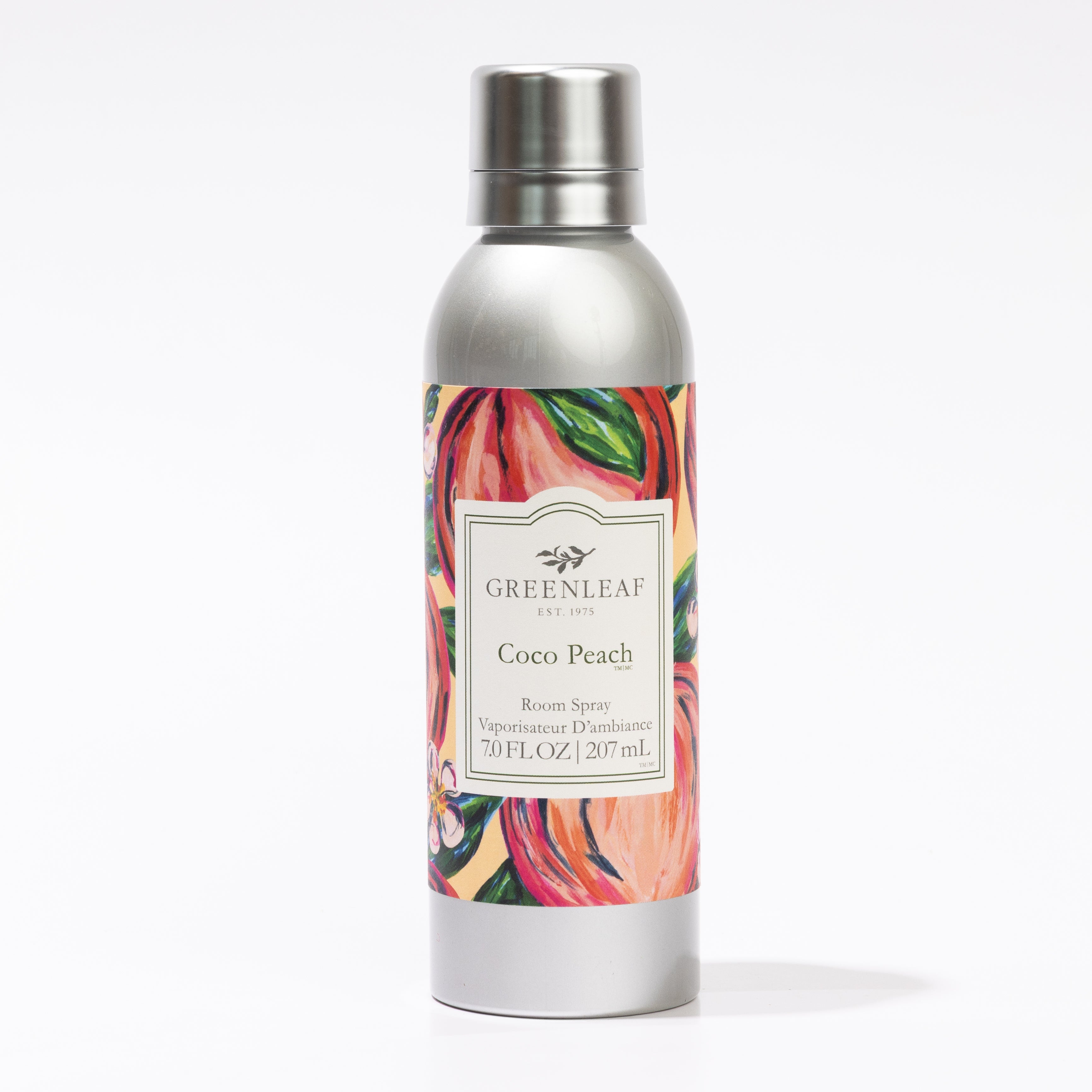 A silver non-aerosol canister labeled Greenleaf Gifts Coco Peach Room Spray features a colorful peach and floral design. The 7 oz (207 mL) spray offers refreshing Greenleaf fragrance for your space.