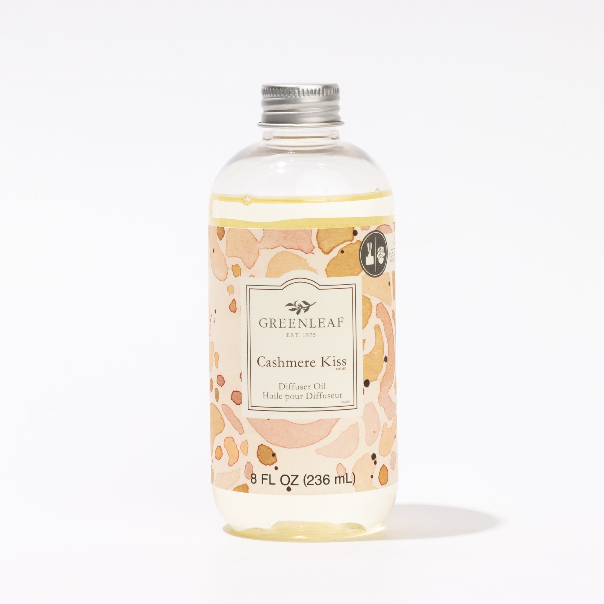An 8 fl oz (236 mL) clear bottle of Greenleaf Gifts Cashmere Kiss Diffuser Oil with a silver cap and beige floral label, ideal as a reed diffuser refill, shown against a white background.