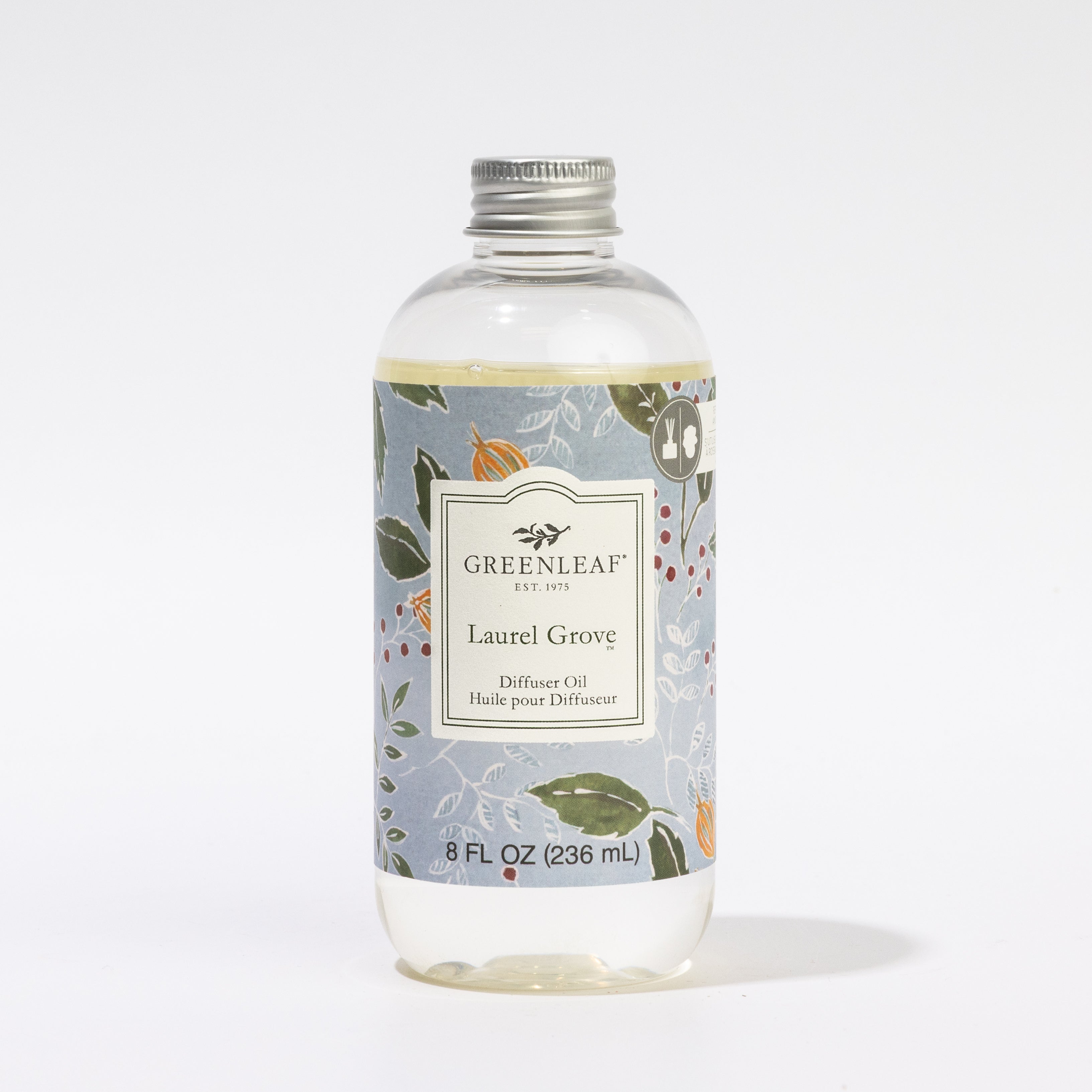 A clear 8 oz Greenleaf Gifts Laurel Grove Diffuser Refill Oil bottle with a silver cap and floral label, designed to last up to 30 days, is shown against a plain white background.