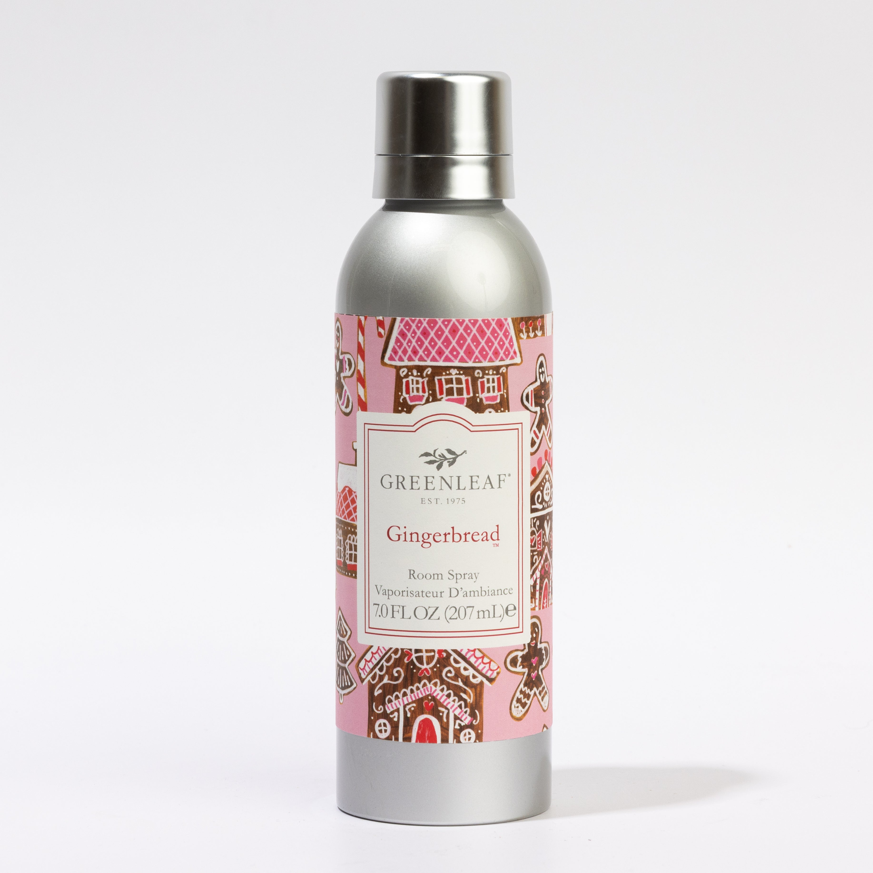A 7 oz (207 ml) silver canister of Greenleaf Gifts Gingerbread Room Spray with a pink label featuring gingerbread house illustrations.