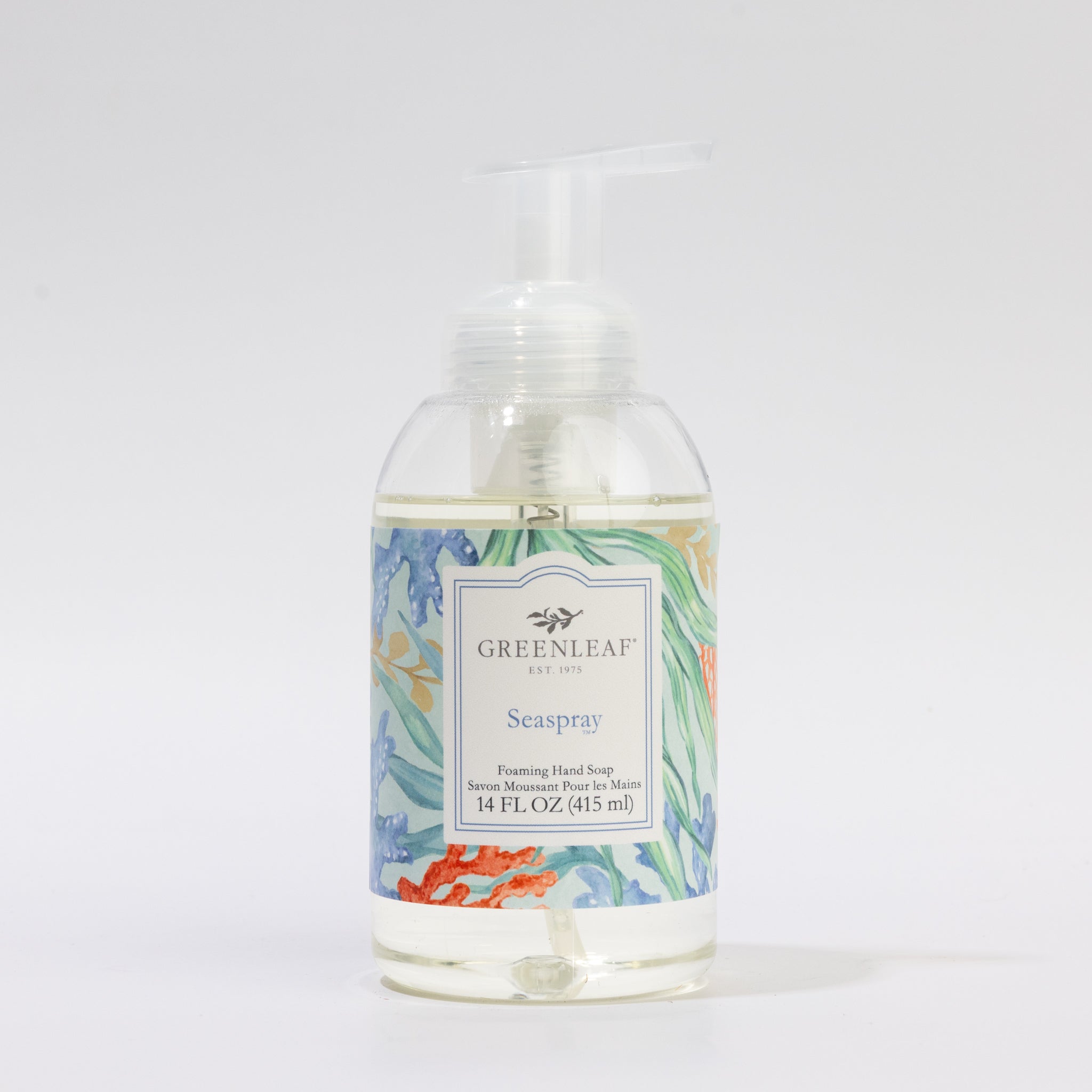 Greenleaf Gifts’ Seaspray Foaming Hand Soap comes in a clear 14 fl oz plastic pump bottle with a vibrant ocean-themed label featuring coral and seaweed—perfect for use by sinks or counters.