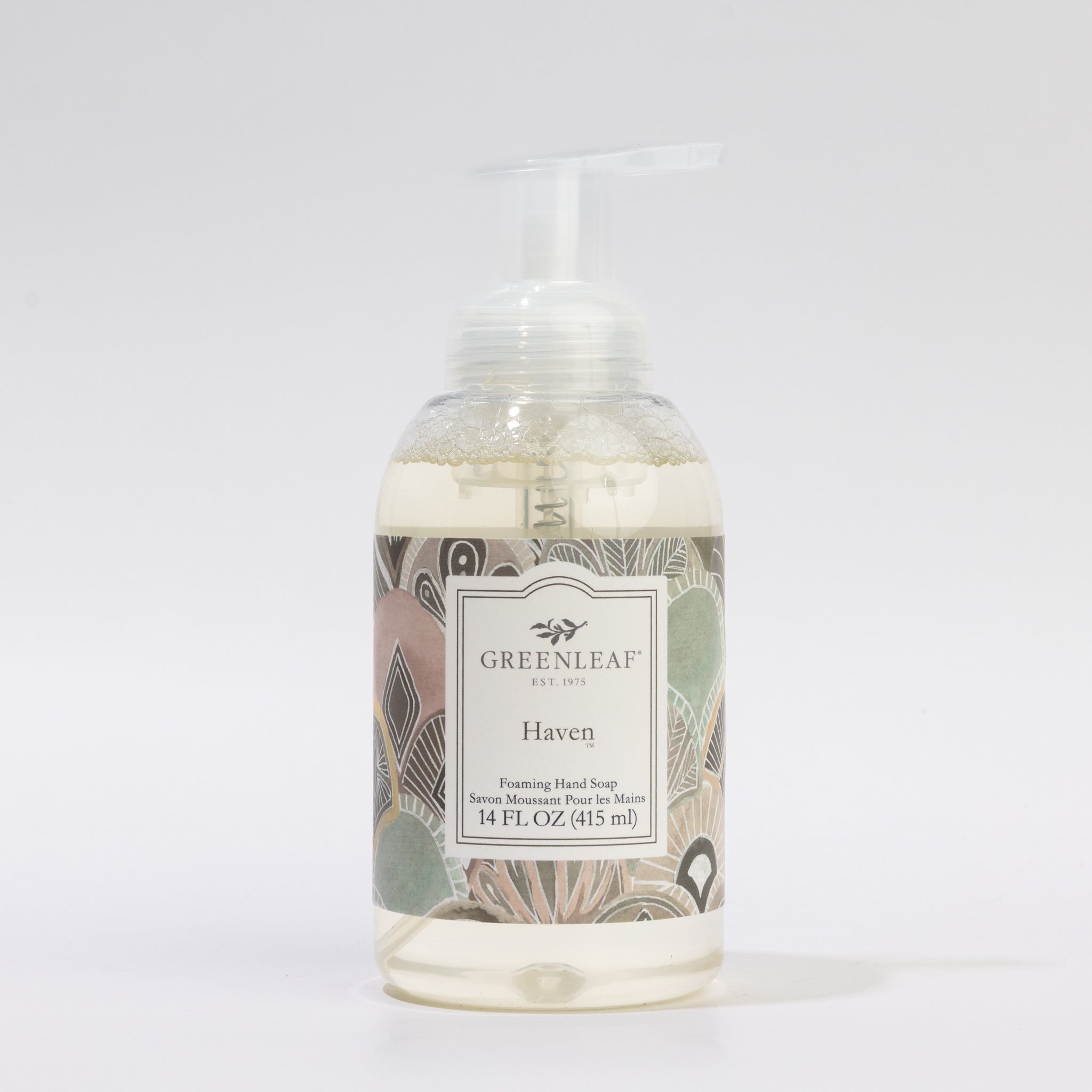A 14 oz clear glass pump bottle of Haven Foaming Hand Soap by Greenleaf Gifts, decorated with a pastel abstract label, is displayed against a plain white background.